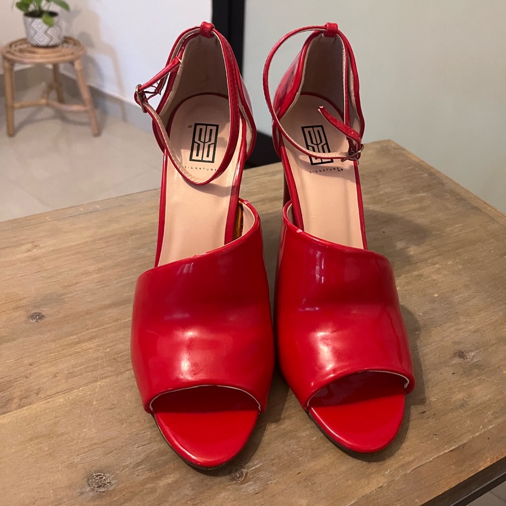 Signature “Drucilla” red heels, 8.5
